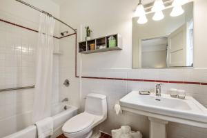 a white bathroom with a sink and a toilet at Parker Guest House in San Francisco