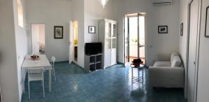 A television and/or entertainment centre at Dolce Vista Apartment Amalfi Coast