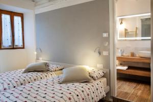 Postel nebo postele na pokoji v ubytování Al Rost B&B