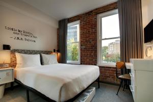 Ένα ή περισσότερα κρεβάτια σε δωμάτιο στο Hotel Hive