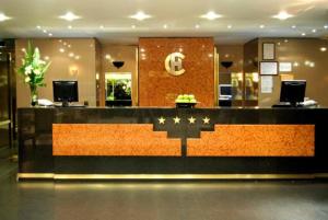 a lobby of a hotel with a reception desk at Hotel Conte in Buenos Aires