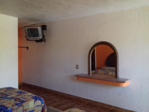 TV a/nebo společenská místnost v ubytování Promotora Hotelera Tocuila
