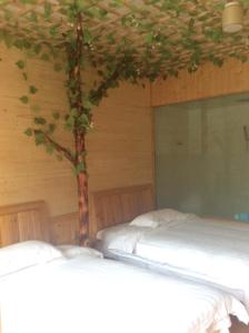 Cama o camas de una habitación en Yangjiajie Inn