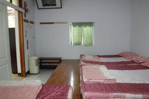 Katil atau katil-katil dalam bilik di Fei Ying Homestay