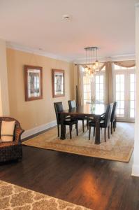 a dining room with a table and chairs at 5 Bedroom House in Best Location Parking Fireplace Back Yard Home office in Chicago