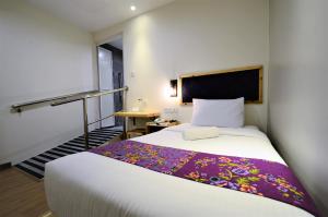 Postel nebo postele na pokoji v ubytování Artisan Eco Hotel