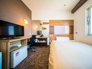Postel nebo postele na pokoji v ubytování Super Hotel Kochi + 37 fotografií