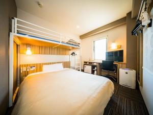 Postel nebo postele na pokoji v ubytování Super Hotel Kochi