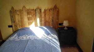 A bed or beds in a room at La Toscana