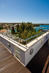a balcony with a view of the water at Villa Andrea in Pula