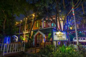 a building with a sign in front of it at night at Bagan Empress Hotel in Bagan