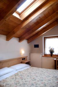 Postel nebo postele na pokoji v ubytování Albergo Ristorante Alle Codole