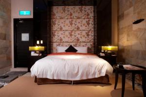 Ένα ή περισσότερα κρεβάτια σε δωμάτιο στο I DO Motel