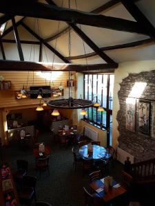 an overhead view of a restaurant with tables and chairs at The Old Barn Inn in Newport