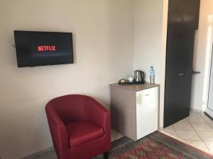 TV a/nebo společenská místnost v ubytování Blue Beach