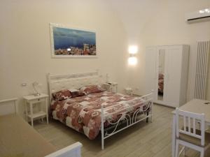 La Maison di Nicoletta tesisinde bir odada yatak veya yataklar