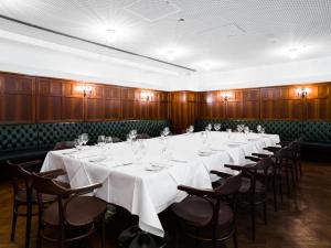 a conference room with a long table and chairs at Grand Ferdinand Vienna – Your Hotel In The City Center in Vienna +66 photos