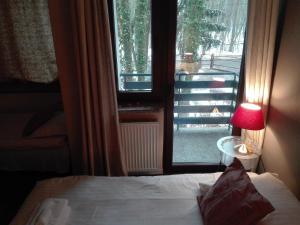 Een bed of bedden in een kamer bij Villa Le Matin
