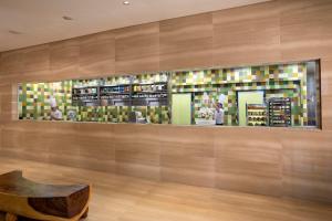 a room with a store with a shelf of products at Carlton Hotel Singapore in Singapore
