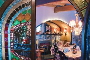 a dining room with a table and a fireplace at La Crestolina in Ala di Stura