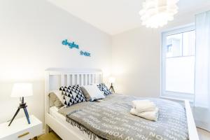 Łóżko lub łóżka w pokoju w obiekcie Equilibrium Apartments