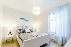 Łóżko lub łóżka w pokoju w obiekcie Equilibrium Apartments