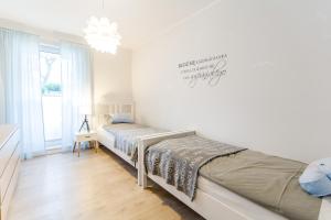 Łóżko lub łóżka w pokoju w obiekcie Equilibrium Apartments