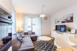 Telewizja i/lub zestaw kina domowego w obiekcie Equilibrium Apartments