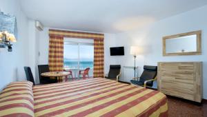 Postel nebo postele na pokoji v ubytování Hotel Apartamentos Bajondillo
