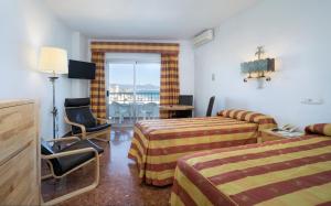 Postel nebo postele na pokoji v ubytování Hotel Apartamentos Bajondillo