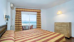 Postel nebo postele na pokoji v ubytování Hotel Apartamentos Bajondillo