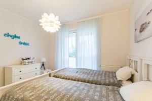 Łóżko lub łóżka w pokoju w obiekcie Equilibrium Apartments