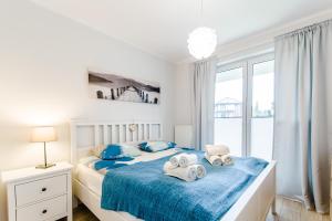 Łóżko lub łóżka w pokoju w obiekcie Equilibrium Apartments