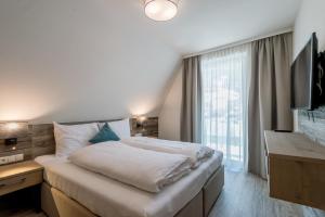 Łóżko lub łóżka w pokoju w obiekcie Top Apart Gaislachkogl