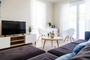 Telewizja i/lub zestaw kina domowego w obiekcie Equilibrium Apartments