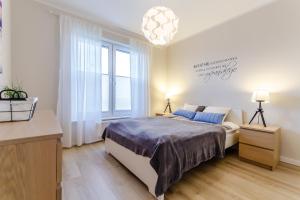 Łóżko lub łóżka w pokoju w obiekcie Equilibrium Apartments