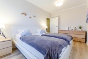 Łóżko lub łóżka w pokoju w obiekcie Equilibrium Apartments