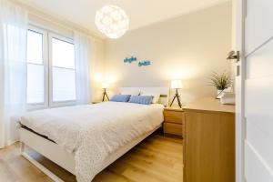 Łóżko lub łóżka w pokoju w obiekcie Equilibrium Apartments