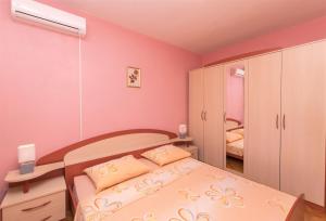 Postel nebo postele na pokoji v ubytování Apartments Albina
