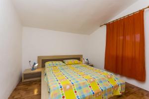 Postel nebo postele na pokoji v ubytování Apartments Kata