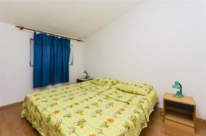 Postel nebo postele na pokoji v ubytování Apartments Kata