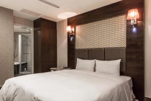 Postel nebo postele na pokoji v ubytování Maple Hotel + 37 fotografií