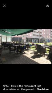 a group of tables and chairs sitting on a patio at 1 Bedroom flat in Kosovo Polje +15 photos