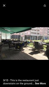 a group of tables and chairs sitting on a patio at 1 Bedroom flat in Kosovo Polje