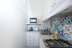 Köök või kööginurk majutusasutuses Casa Amore S Lucia