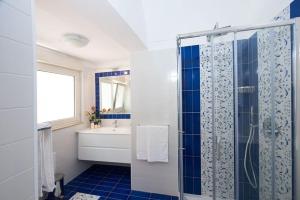 a bathroom with a shower and a sink at Casa Amore S Lucia in Amalfi +38 photos