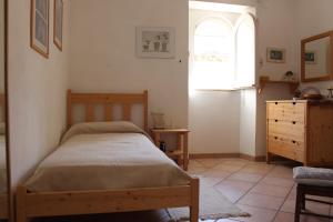 Giường trong phòng chung tại Tropea rooftop