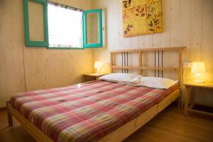 Postel nebo postele na pokoji v ubytování Camping OASI