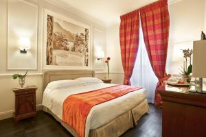 Кровать или кровати в номере Albergo Terminus