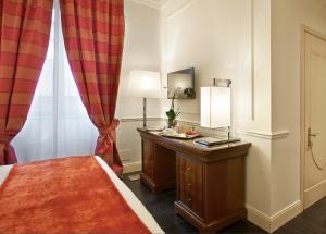 Кровать или кровати в номере Albergo Terminus